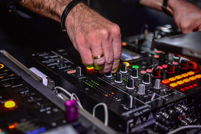 Hands adjusting regulators of a mixer unit