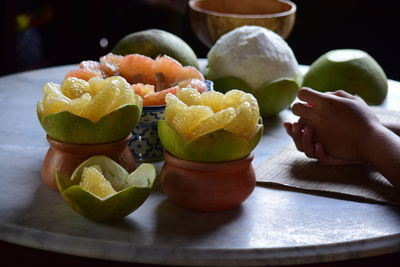 Close-up of fruits in plate on table