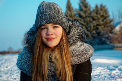 Portrait of smiling teenager girl in winter