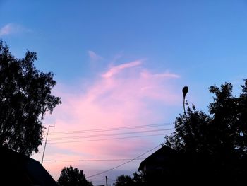 Low angle view of silhouette trees against sky during sunset