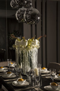 Close-up of wine glasses on table at home