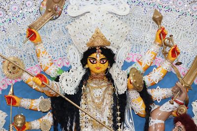 Low angle view of statue against temple