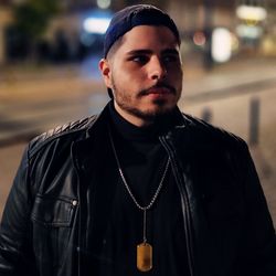 Portrait of young man standing outdoors