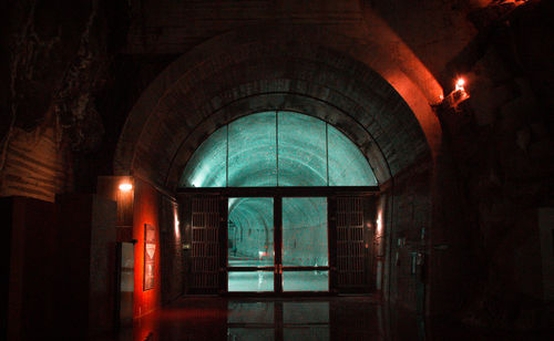 Illuminated building seen through window