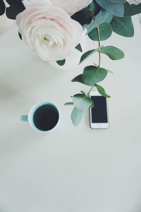 Close-up of roses in vase on table