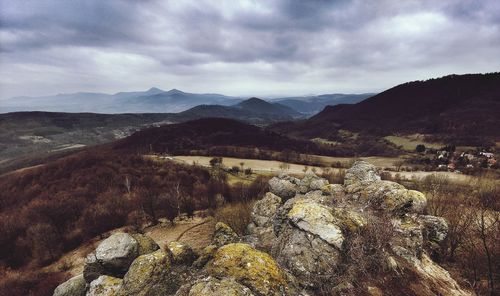 Scenic view of landscape and mountains against sky