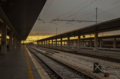 Train at railroad station against sky