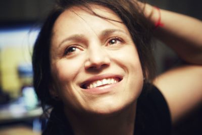 Close-up portrait of a smiling young woman