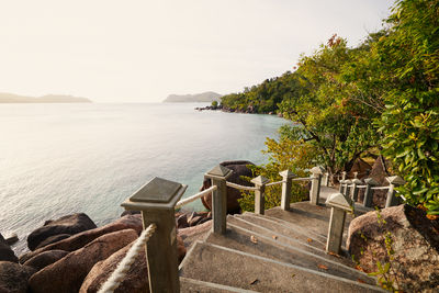Stairs leading to idyllic beach. coastal landscape on coast of seychelles