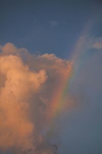 Low angle view of rainbow against sky during sunset