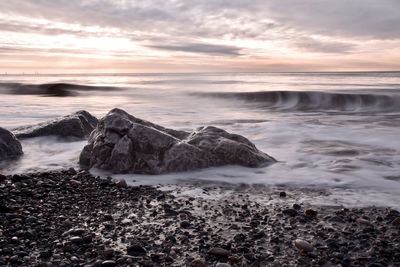 Scenic view of sea against sky during sunset