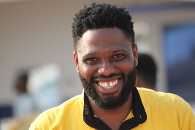 Close-up portrait of smiling young man