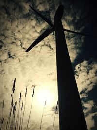 Low angle view of electricity pylon against sky