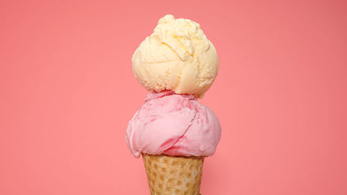 Close-up of ice cream against pink background