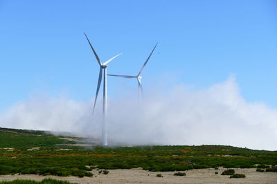 Low angle view of windmill against clear sky