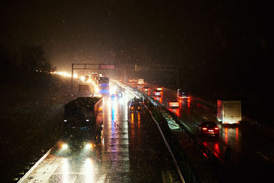 Car accident on slippery road at night during snowfall