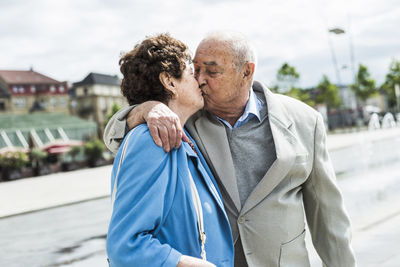 Senior man kissing his wife