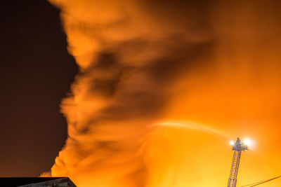 Spraying water against smoke