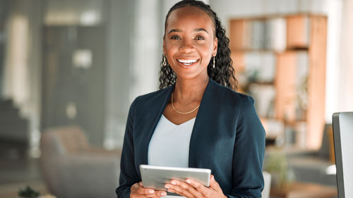 Portrait of young woman using mobile phone