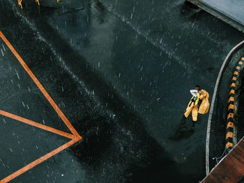 High angle view of people walking on road