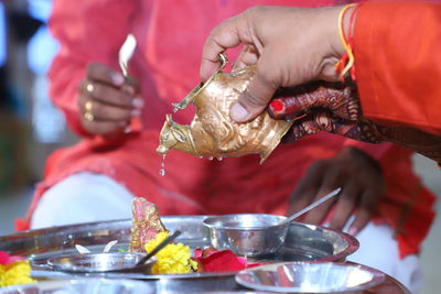 Midsection of person preparing food