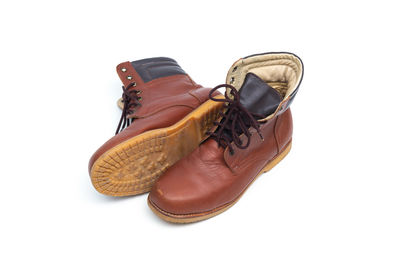 Close-up of shoes against white background