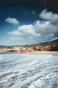 Scenic view of beach and sea against sky