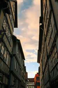 Low angle view of building against cloudy sky