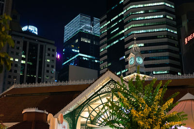 Low angle view of illuminated buildings at night