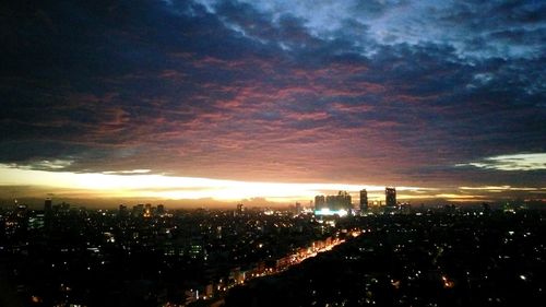 Aerial view of illuminated cityscape at night