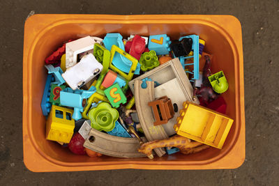 High angle view of toys in container