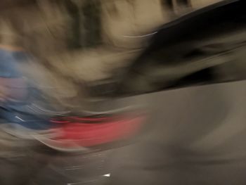 Defocused image of blurred motion of car