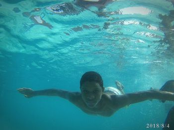 Portrait of man swimming in sea