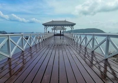 Pier over sea against sky