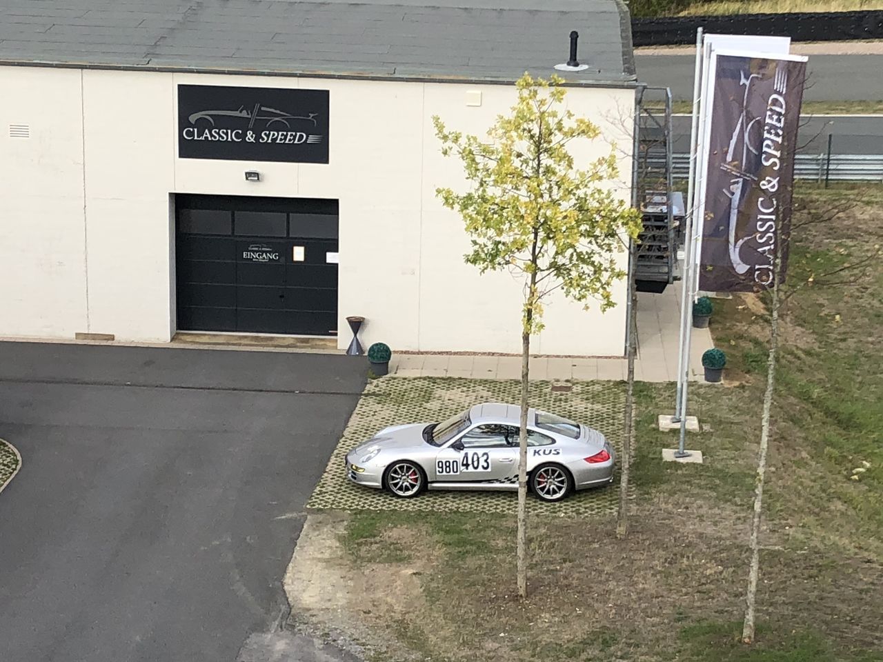 INFORMATION SIGN ON ROAD AGAINST BUILDING