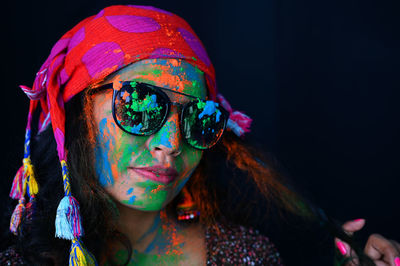 A young girl celebrating the festival of colours, holi.