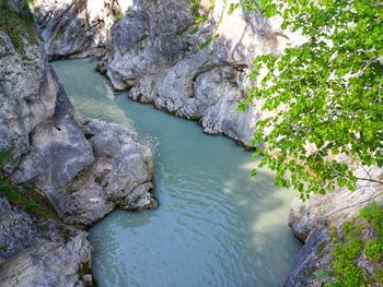 High angle view of river amidst rocks