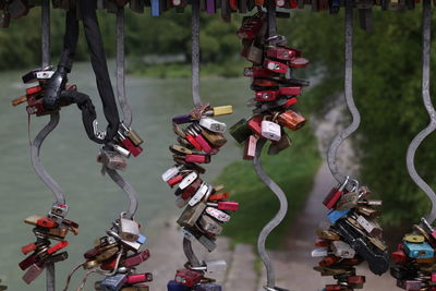 Close-up of padlocks hanging on metallic railing