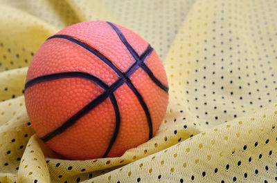 Close-up of basketball on textile