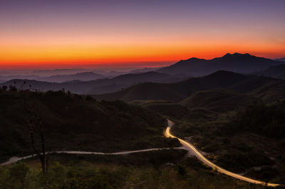 Scenic view of silhouette mountains against sky during sunset