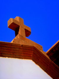 Low angle view of temple against clear blue sky