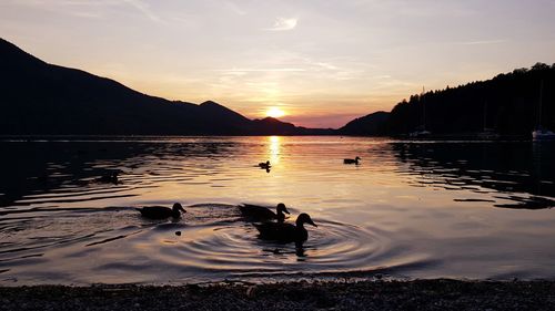 Scenic view of lake against sky during sunset