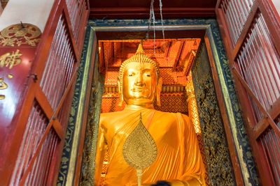 Low angle view of statue against building