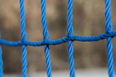 Close-up of rope tied on metal