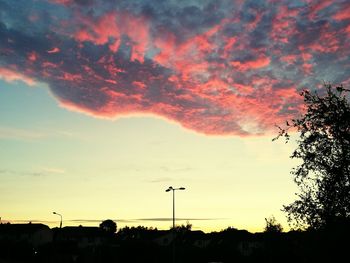 Low angle view of silhouette trees against sky at sunset