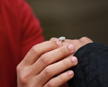 Close-up of couple holding hands