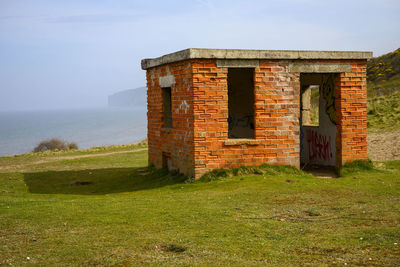 Built structure on field against clear sky