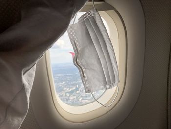 Airplane flying seen through window