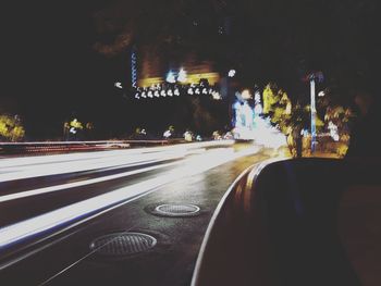 Close-up of car on road at night