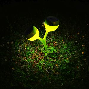 Close-up of yellow leaf on grass at night